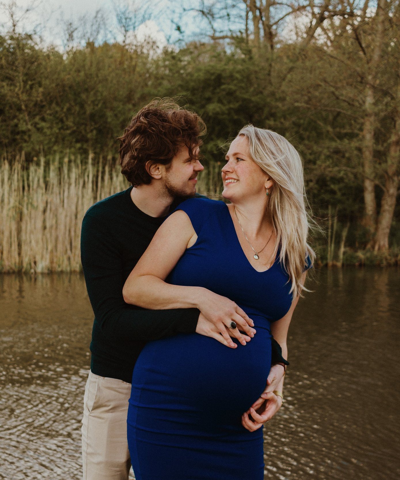 Couple expecting a baby, in the reeds